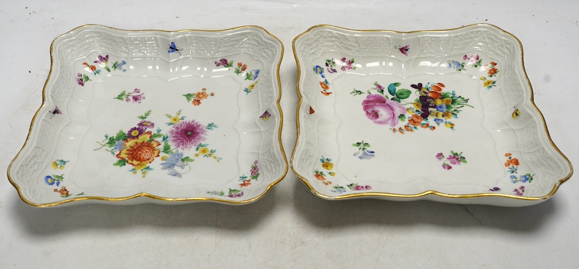 A pair of Meissen square shaped dishes, painted with scattered floral sprigs. Condition - fair to good